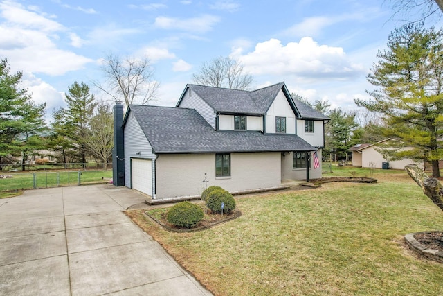 view of front of property with a garage and a front yard