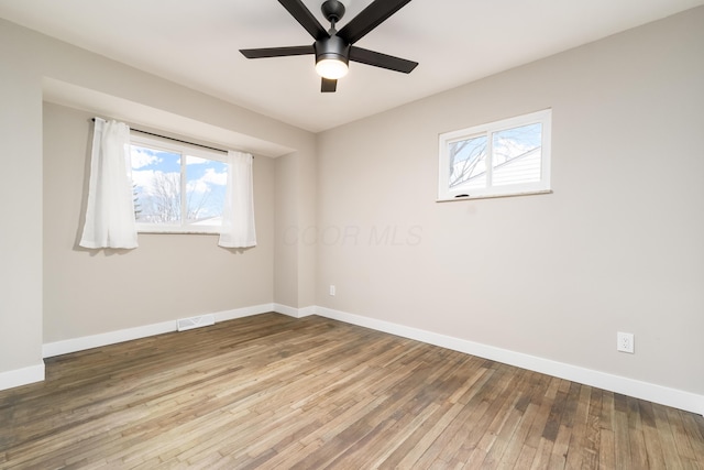 unfurnished room featuring hardwood / wood-style flooring and ceiling fan