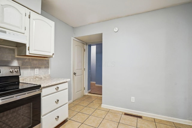 kitchen with white cabinetry, tasteful backsplash, light tile patterned flooring, and stainless steel range with electric cooktop