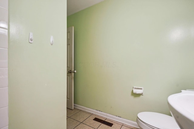 bathroom featuring tile patterned floors and toilet