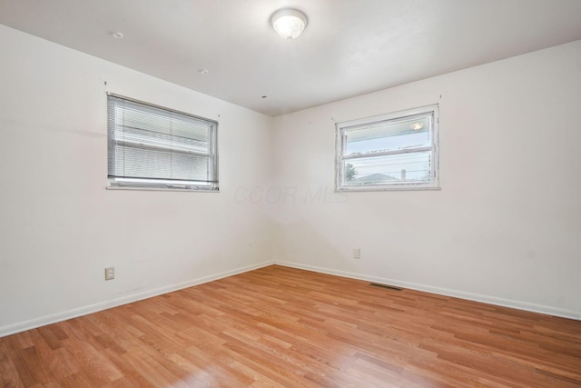 empty room featuring light hardwood / wood-style floors