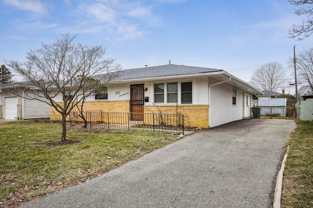 ranch-style home with a front yard and cooling unit