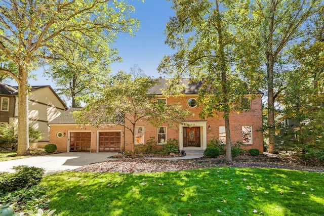 view of front of property with a garage and a front yard