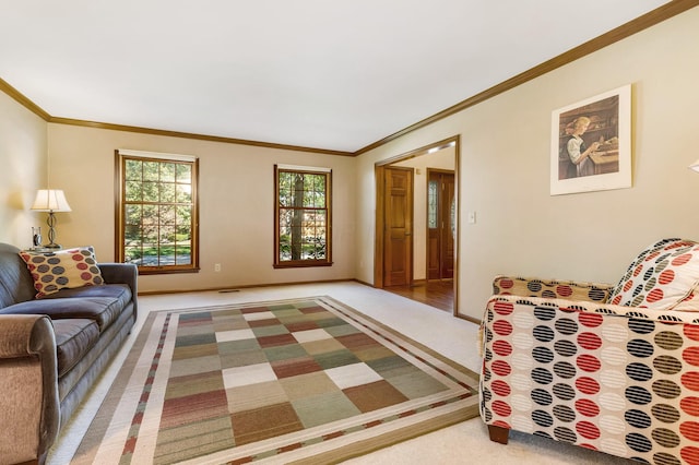 carpeted living room featuring ornamental molding