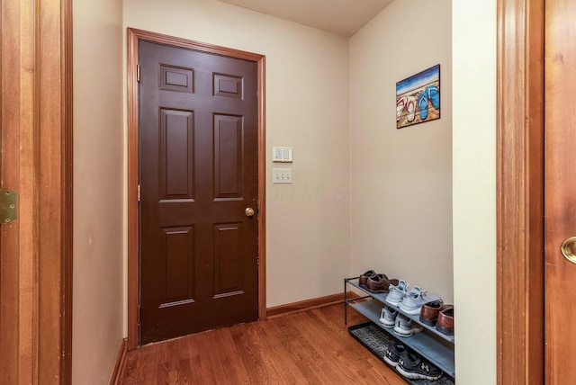 doorway to outside with hardwood / wood-style flooring