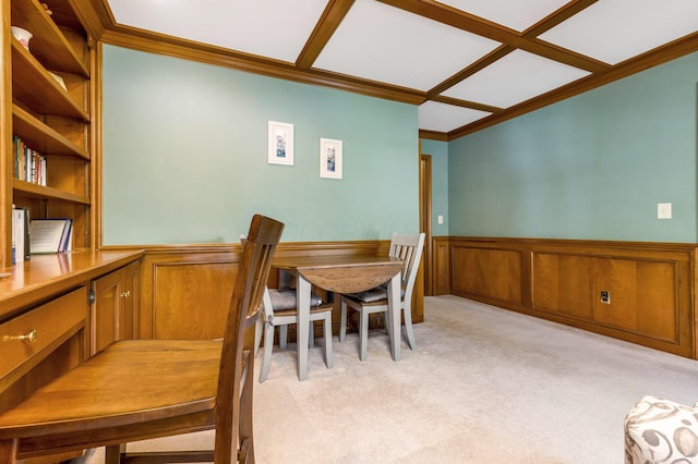 dining room with crown molding and light colored carpet