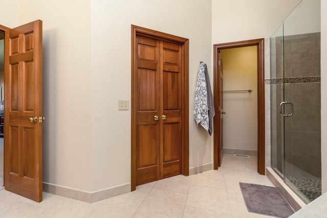 bathroom featuring walk in shower and tile patterned floors