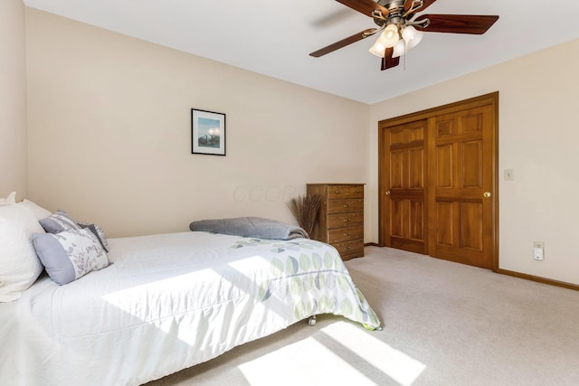 bedroom with ceiling fan and carpet