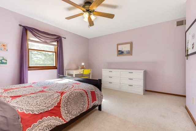 bedroom featuring ceiling fan and light carpet