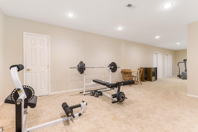 workout room with light colored carpet