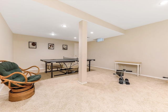 rec room with light colored carpet