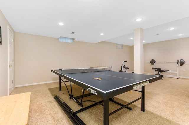 recreation room featuring light carpet