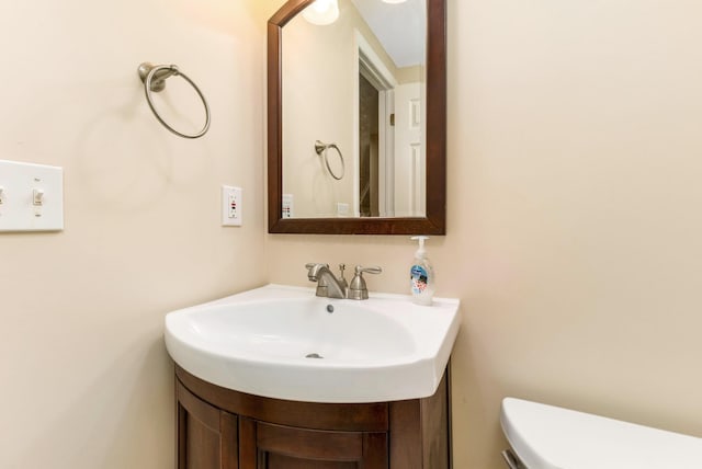 bathroom with vanity and toilet