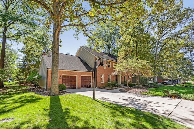 view of front of property with a garage and a front yard