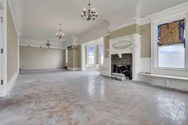 unfurnished living room featuring a notable chandelier