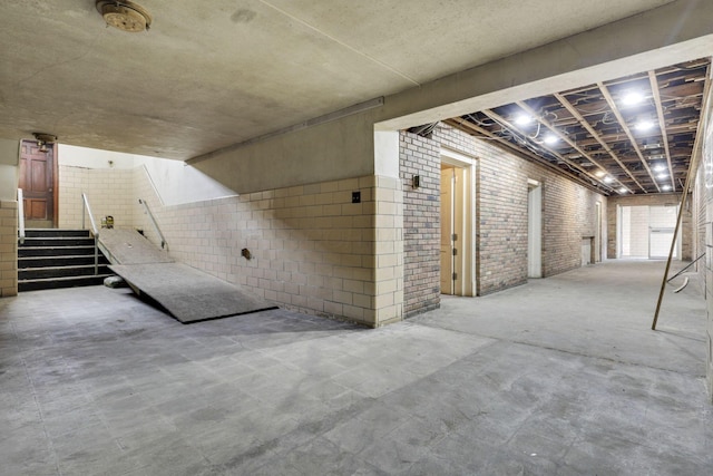 basement with brick wall