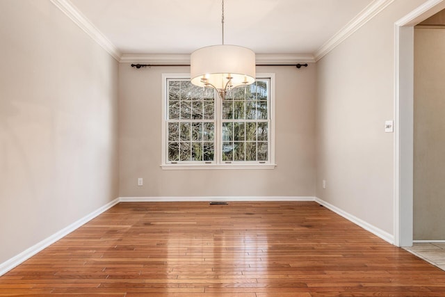 unfurnished dining area featuring wood-type flooring and ornamental molding