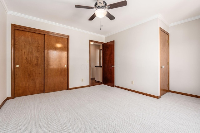 unfurnished bedroom featuring a closet, ornamental molding, and light carpet