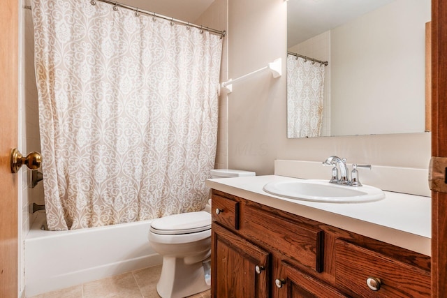 full bathroom with tile patterned flooring, vanity, shower / bath combo, and toilet