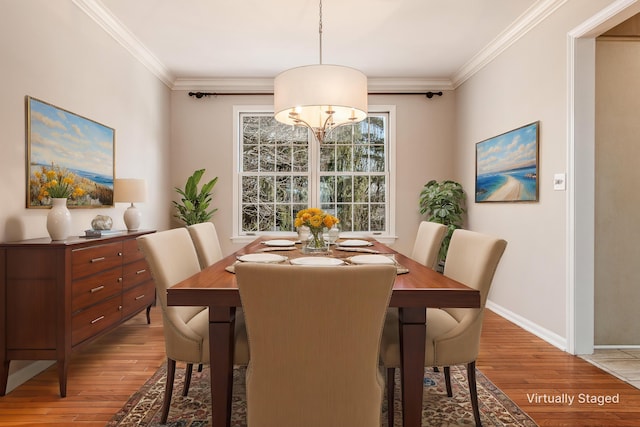 dining area featuring crown molding and wood-type flooring