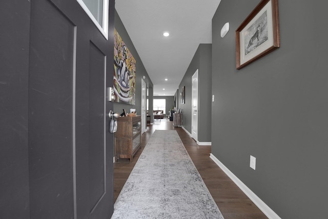 corridor featuring dark hardwood / wood-style flooring