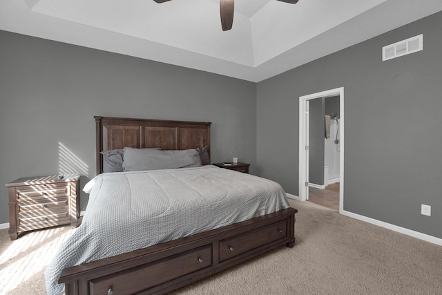 bedroom with ceiling fan and light carpet