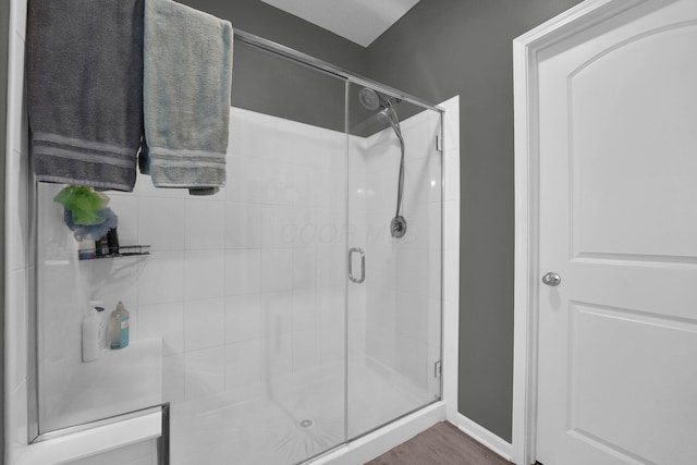 bathroom with a shower with shower door