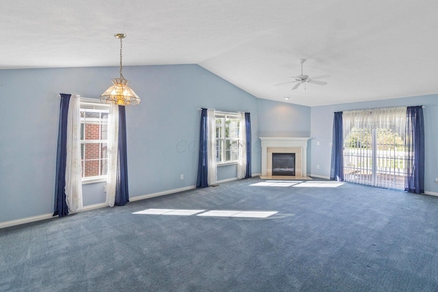 unfurnished living room featuring vaulted ceiling, ceiling fan, and carpet