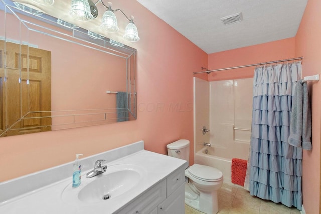 full bathroom featuring toilet, a textured ceiling, vanity, shower / bath combination with curtain, and tile patterned flooring