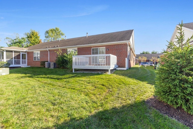 rear view of property with a yard