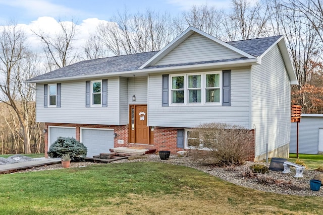 raised ranch featuring a garage and a front lawn