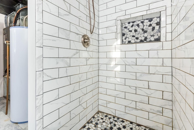 bathroom featuring water heater and a tile shower