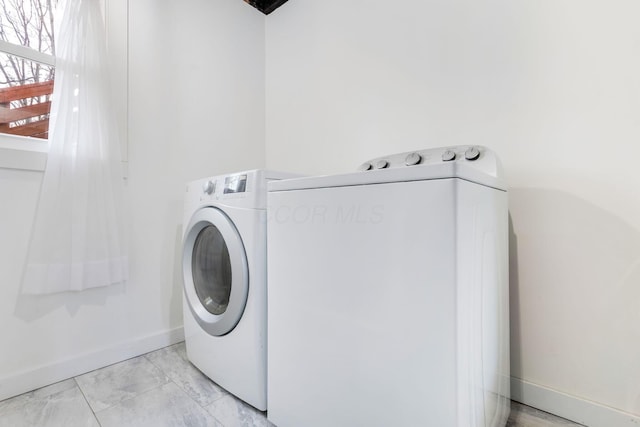 laundry room featuring washer / dryer