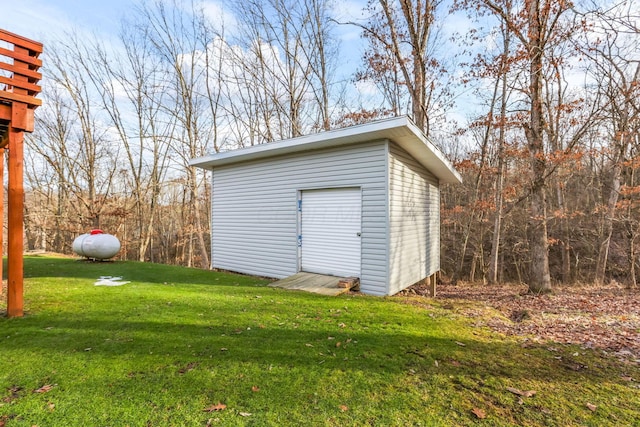 view of outbuilding featuring a lawn