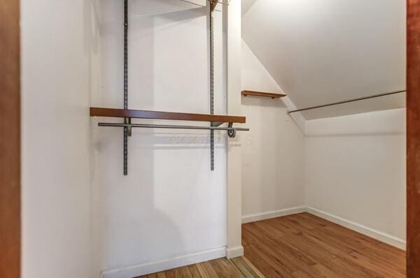 spacious closet with light hardwood / wood-style floors