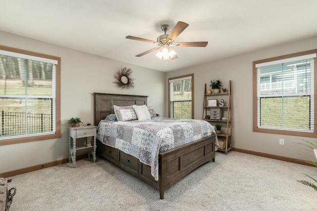 bedroom featuring light carpet and ceiling fan