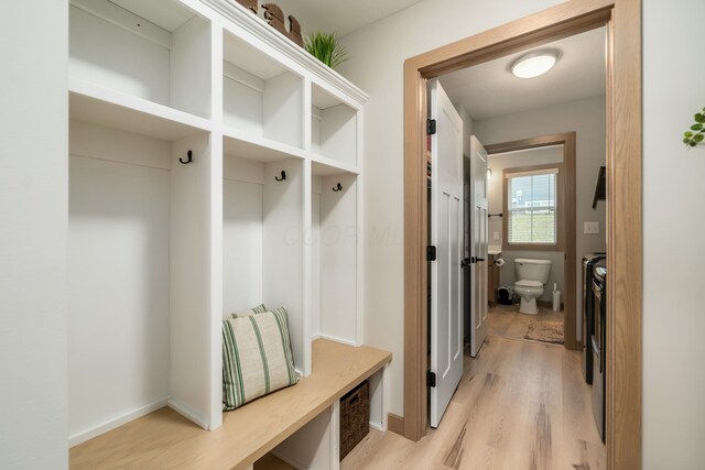 mudroom with light hardwood / wood-style floors