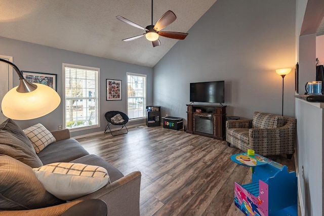 living room featuring a textured ceiling, wood-type flooring, high vaulted ceiling, and ceiling fan