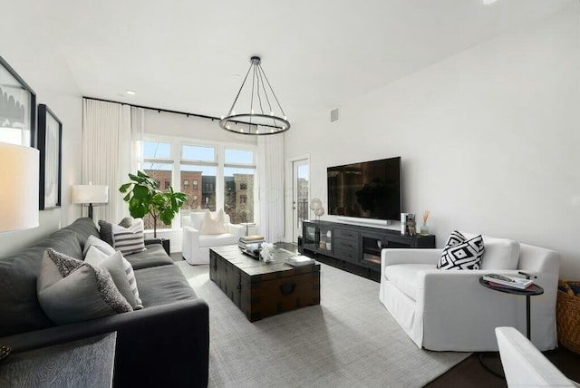 living room featuring an inviting chandelier