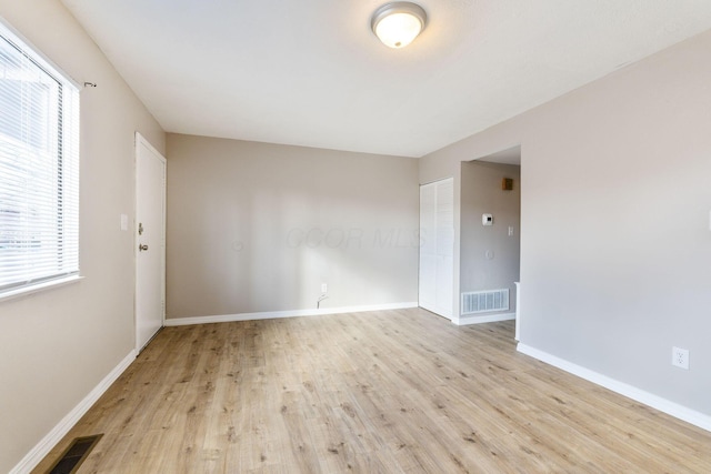 unfurnished room featuring light hardwood / wood-style flooring