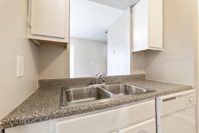 kitchen featuring white cabinetry, sink, and dishwasher