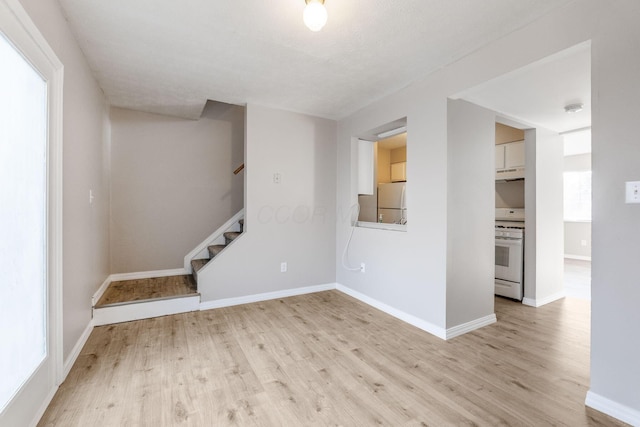 spare room featuring light wood-type flooring