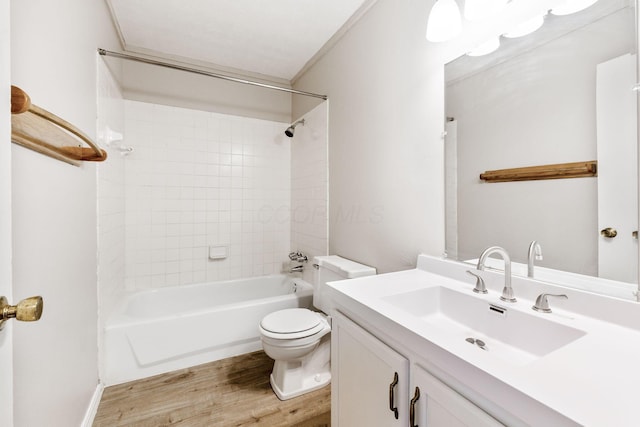 full bathroom with vanity, tiled shower / bath combo, wood-type flooring, and toilet