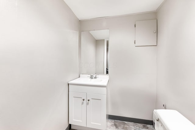 bathroom featuring vanity and toilet