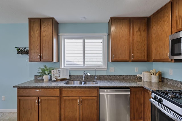 kitchen with sink and appliances with stainless steel finishes