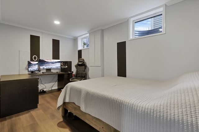 bedroom featuring hardwood / wood-style flooring and ornamental molding