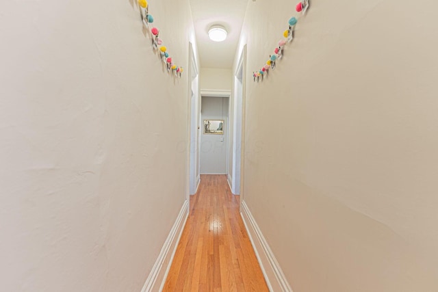 corridor featuring light hardwood / wood-style floors