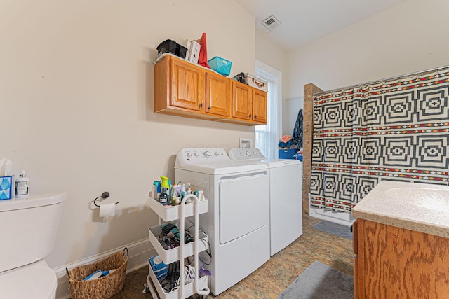 washroom featuring washer and dryer