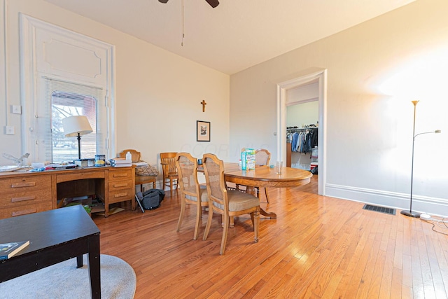 dining room featuring light hardwood / wood-style floors and ceiling fan