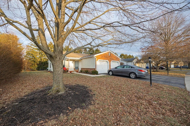 ranch-style house featuring a garage